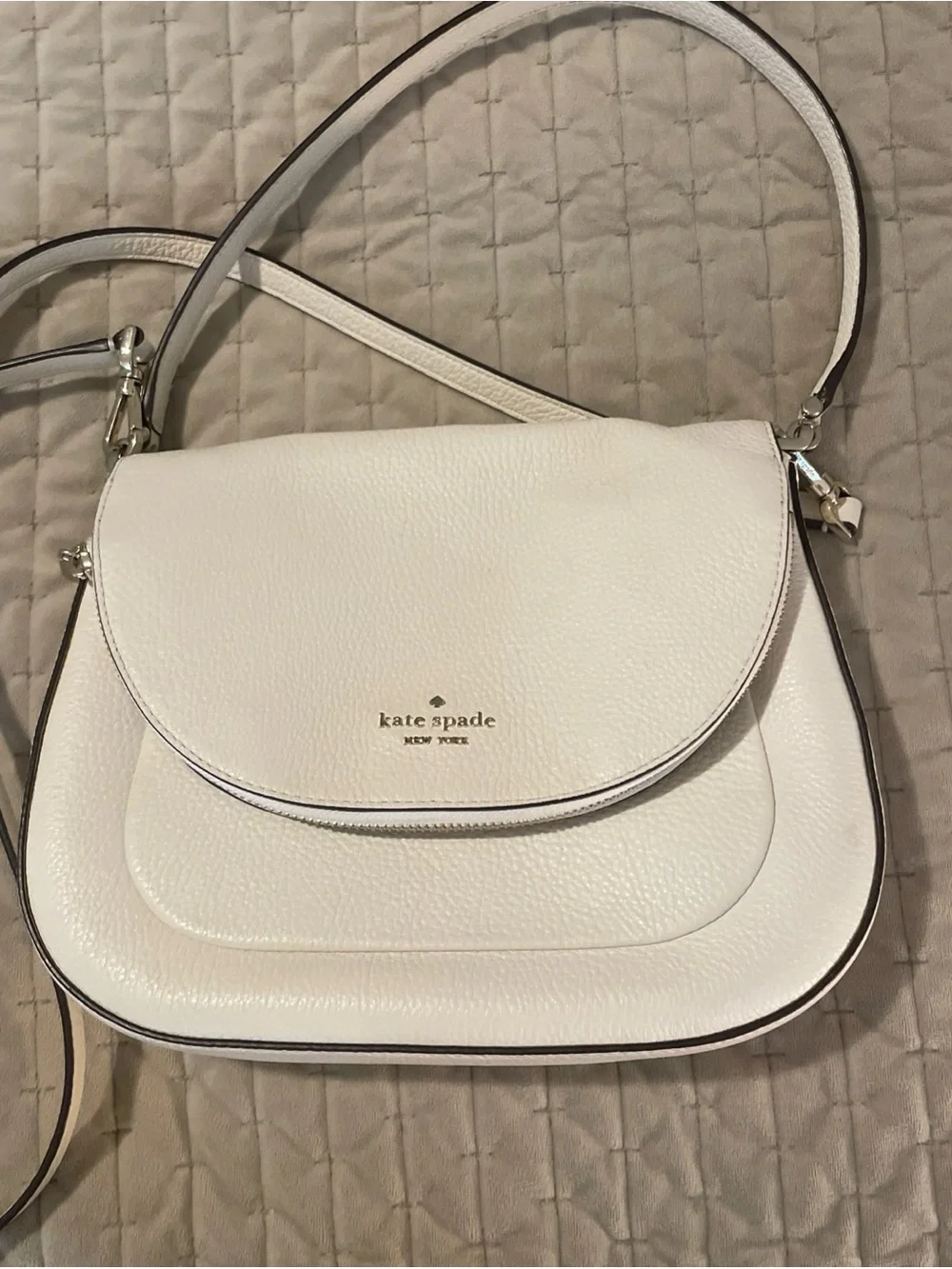 kate spade cream pebbled leather crossbody with gold logo